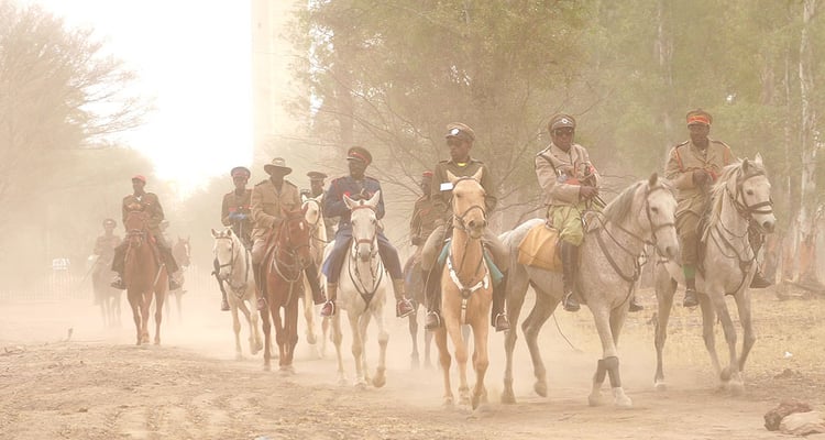 Horsemen uniform OvaHerero commemoration grave Paramount Chief Samuel Maharero Okahandja NamibiaÂ 