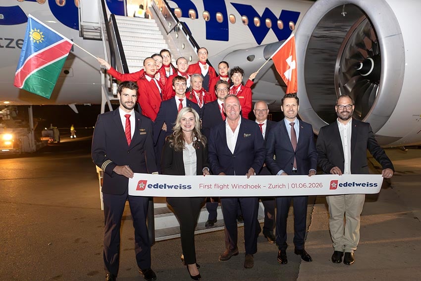 Symbolic cutting red ribbon before maiden return flight from Windhoek to Zurich Edelweiss CEO Bernd Bauer center and Renette Scholtz Lufthansa Group Account Manager in Namibia 2nd from left with flight crew Photo Edelweiss