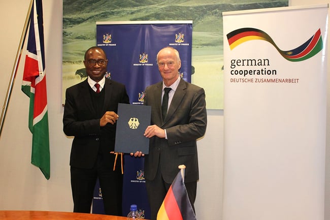 Namibias FInance Minister iipumbu Shiimi (L) signed a loan agreement with German Ambassador Herbert Beck. Photo: German Embassy