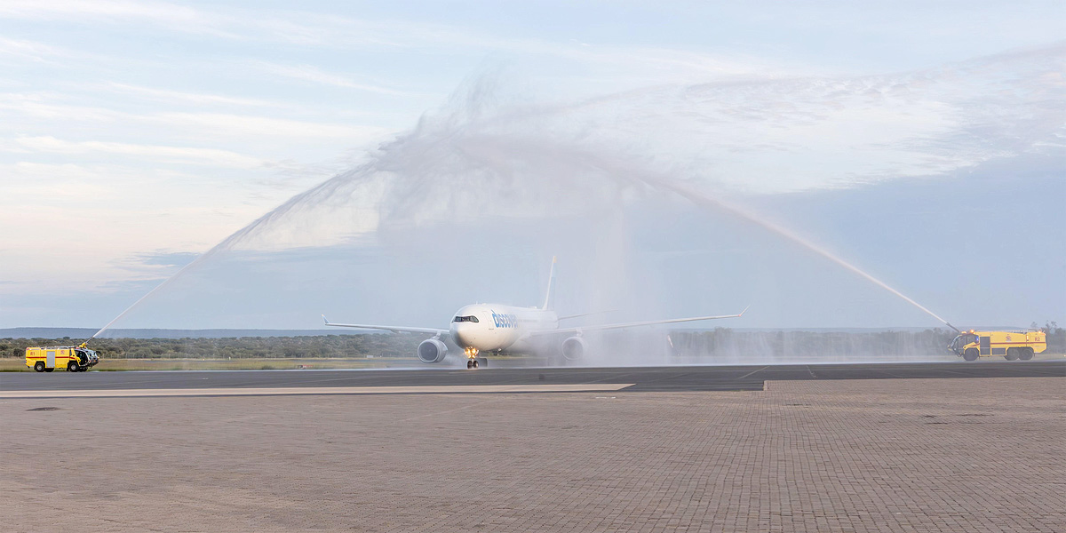 Water fountains welcoming Airbus aircraft Discover Airlines maiden flight new route Munich Windhoek